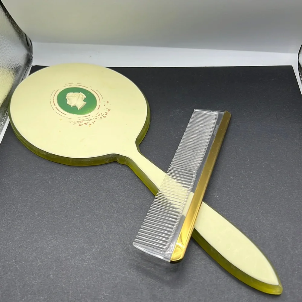 Vintage green celluloid hand mirror and comb set